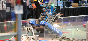 An FRC Robot crossing the field during game play.