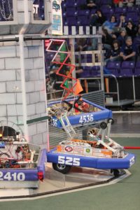 Robots climbing at the end of a match in 2016.