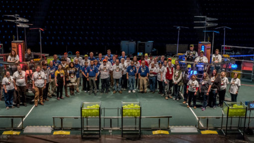Group Volunteer photo from 2017 Iowa Regional.  Event volunteers are standing on the field.  