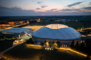 Evening overhead view of the University of Northern Iowa Dome and McLeod Center.