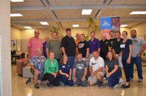 Group photo of Iowa coaches participating in a new coaches workshop.