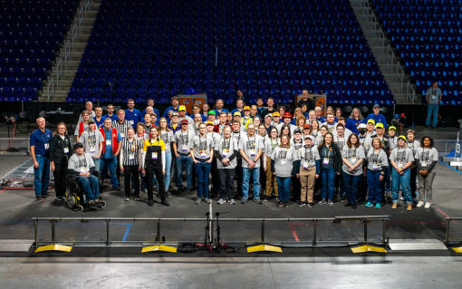 Over 100 volunteers are needed to put on an Regional event.  Group photo of 2023 volunteers standing on the field.