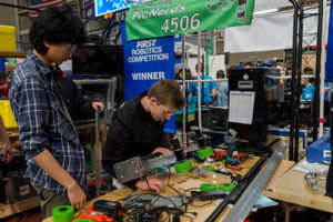 Working on a robot in the pits between matches.