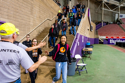 Welcome teams, volunteers offer high fives to students as they arrive each morning.