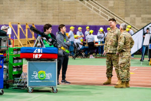 US Air Force members greeting teams as they arrive.