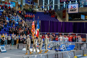 Waterloo students present the flag during opening ceremonies.
